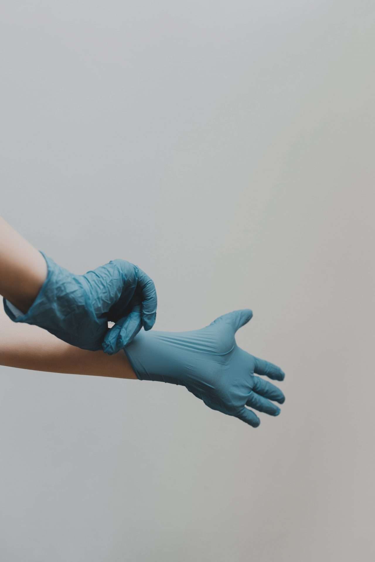 a person wearing blue gloves