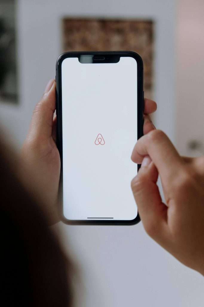 Professional cleaners resetting an Airbnb in London after a guest's departure, readying it for the next visitors.