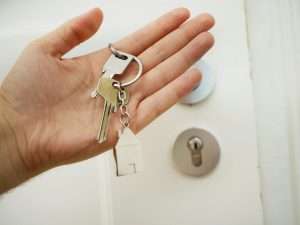 a hand holding a key chain